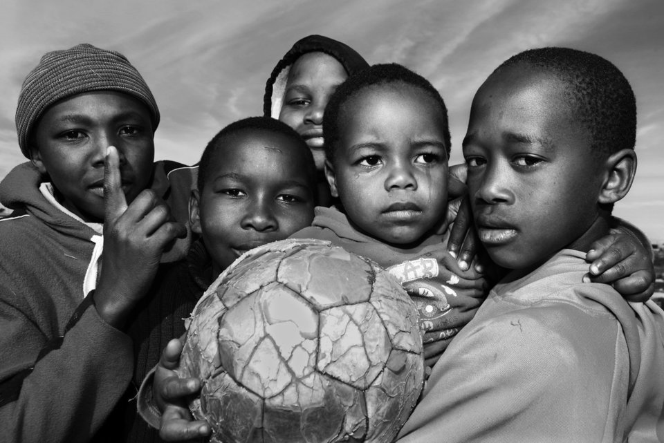 Portraits of Gugulethu townshipÕs children the day after the South African Soccer World Cup's semifinals between Netherlands and Uruguay in Cape Town, South Africa, Jul. 7, 2010. Gugulethu is one of the oldest marginal areas of Cape Town in which the investment for the World Cup has not helped to change its reality. High unemployment, lack of opportunities, lack of sanitary facilities, violence and housing precariousness are common problems in the township that is situated only 15 km from Green Point, the semifinal stadium, which costed more than 600 million dollars. (Photo: Andres Kudacki)