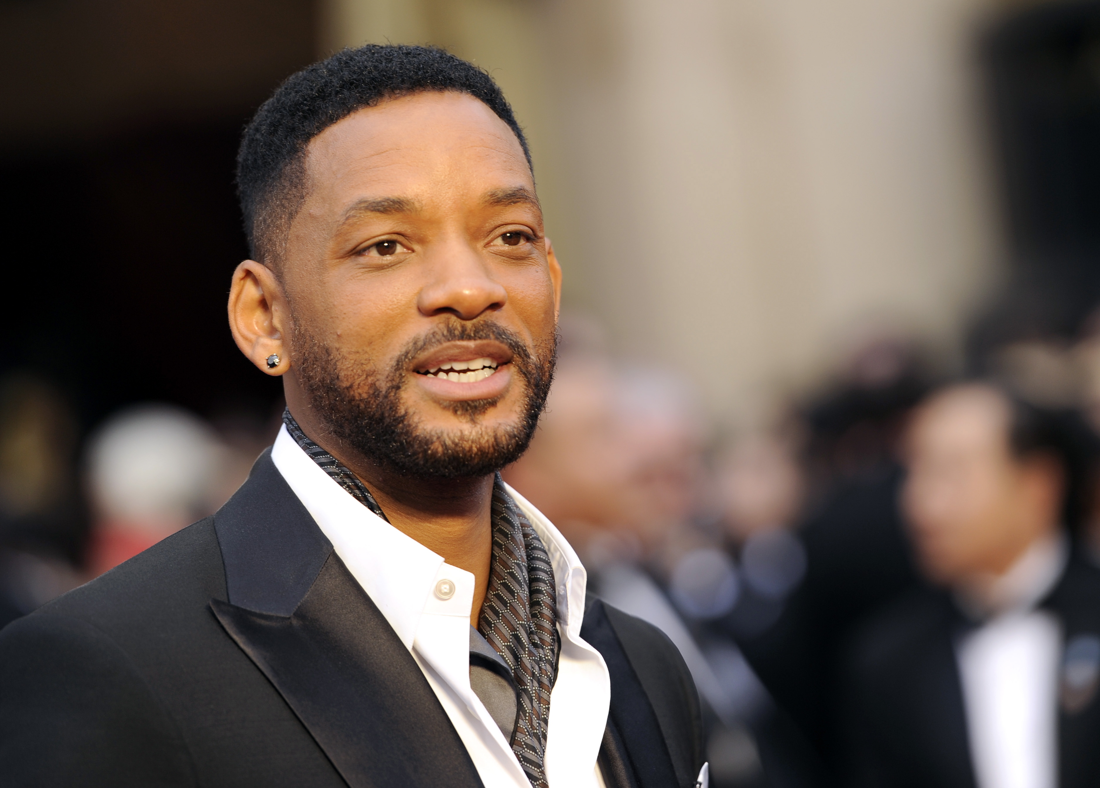 FILE - In this March 2, 2014 file photo, Will Smith arrives at the Oscars at the Dolby Theatre in Los Angeles. Smith, Jared Leto and Tom Hardy are suiting up for DC Comics supervillain team-up film Suicide Squad. Warner Bros. confirmed the much anticipated casting of the film in an announcement Tuesday, Dec. 2, 2014.  (Photo by Chris Pizzello/Invision/AP, File)