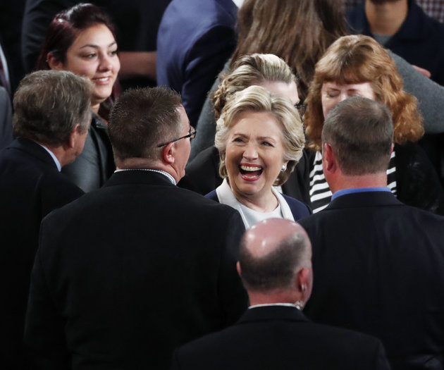 Democratic U.S. presidential nominee Hillary Clinton speaks with participants after her presidential town hall debate against Republican U.S. presidential nominee Donald Trump (not shown) at Washington University in St. Louis, Missouri, U.S., October 9, 2016. REUTERS/Aaron P. Bernstein